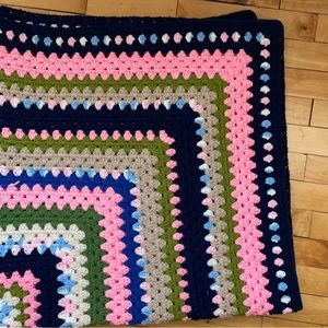 Vintage crocheted blue and pink blanket. 48x48